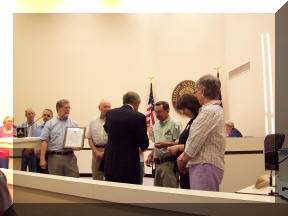 SARC / ARES volunteers receiving Volunteer of Year award from City of KM for Triathlon participation
